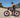 Motorcycle-style pedal bike with fat tires on a road